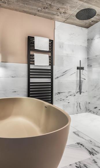 The bathroom of the new suite with a bathtub and a shower